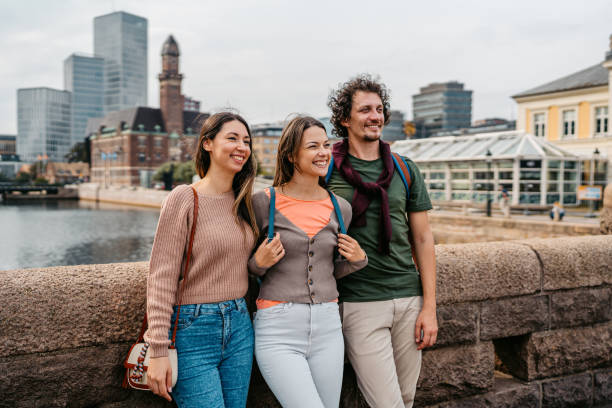 istock Three Young Friends On The Bridge In Malmo In Sweden 1798560276