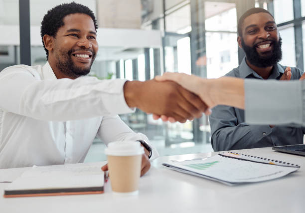 istock Businessman, handshake and meeting for b2b, interview or partnership in collaboration, support and trust at the office. Man shaking hands of new employee for hiring, welcome or agreement on work deal 1798564107