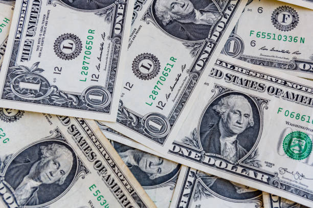 istock Heap of the one dollar banknotes for background 1798568062