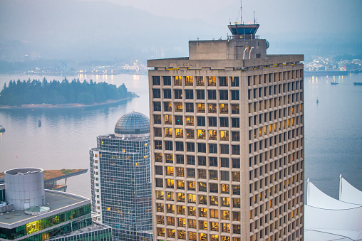 colorful autumn landscape of a modern city with yachts and skyscrapers by the river