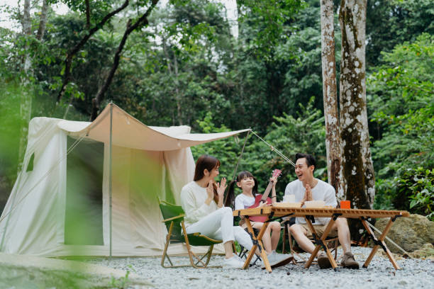 istock Asian family having fun time glamping in the forest 1798592564