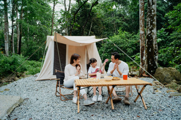 istock Asian family having fun time glamping in the forest 1798592579