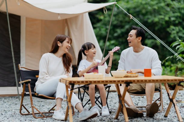 istock Asian family having fun time next to a canvas tent 1798592585