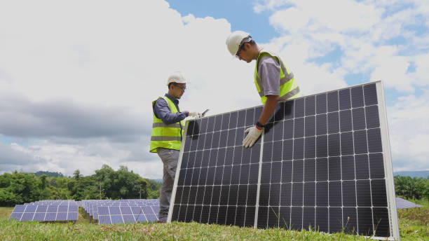 istock Professional asian man engineer using digital tablet maintaining solar cell panels together 1798623167