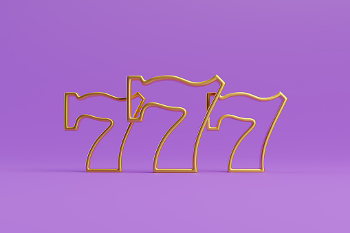 istock Three golden lucky sevens on a purple background 1798624898