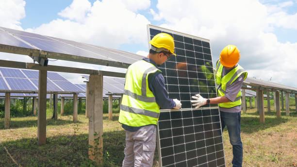 istock Two asian engineers installing solar panels . Solar energy clean and green alternative energy. Unity and teamwork. 1798625995