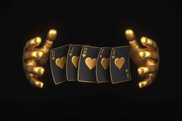 istock Playing cards with golden hand on a black background 1798632248