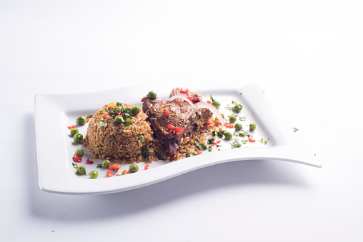 ARROZ CON PATO, RICE WITH DUCK, PERUVIAN GASTRONOMY DISH FROM THE