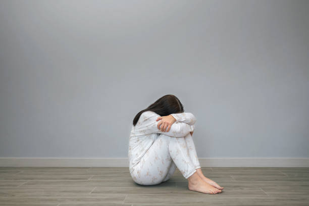 istock Woman with mental disorder and suicidal thoughts crying 1798651282