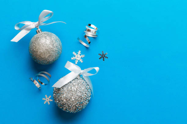 istock Christmas ball on colored background. decoration bauble with ribbon bow with copy space 1798661093