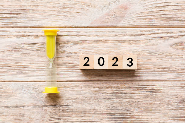 istock New Year 2023 sand timer. Resolution, time, plan, goal, motivation, reboot, countdown and New Year holiday concepts. Hourglass with number 2023 1798662227
