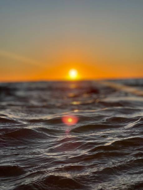 istock lucillel water with bright sun in the sky over it 1798664513