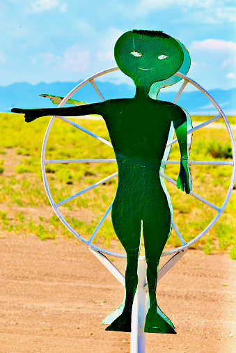 Hooper, Colorado, USA - July 21, 2023: A cartoonish, smiling “alien” welcomes visitors to the UFO Watchtower attraction in Colorado’s San Luis Valley.