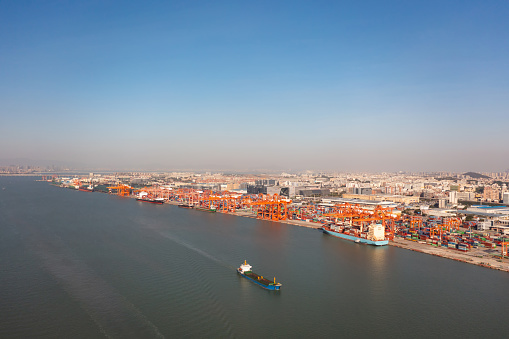 Aerial view of Xiamen city and commercial docks in China