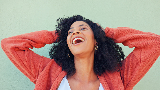 Hands of happy woman play with hair, beauty and smile from Portugal girl feeling freedom, excited and wellness. Happiness, high energy and gen z person with healthy, natural and good curly hair care