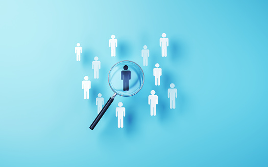 3d Render Selected human icon in metallic magnifying glass on soft blue background, hit the target at 12, recruiting, focus, leader concept (close-up)