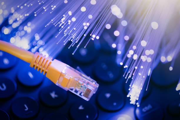 istock Internet cable, RJ-45 plug on laptop keyboard. 1798728018