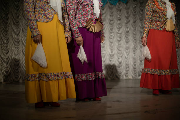 istock Folk costumes. Women perform on stage. Folklore ensemble. 1798755398