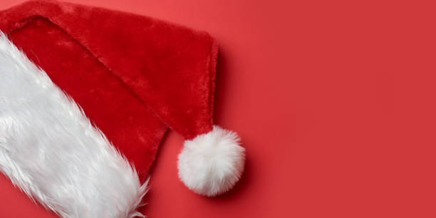 istock santa claus hat isolated on red background 1798800853