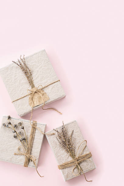 istock Gift boxes decorated dried flowers top view. Holidays present greeting concept. 1798801892
