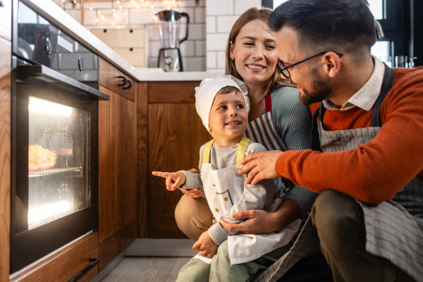 istock Family preparing dinner together 1798865091
