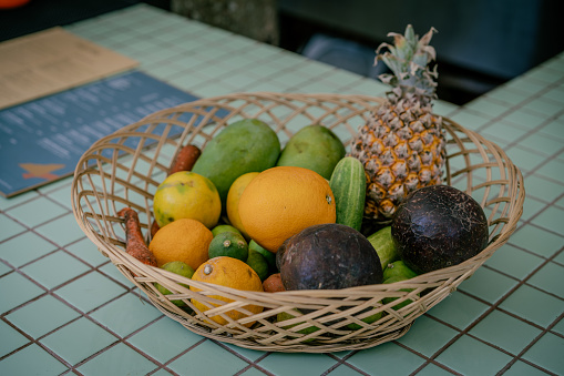 Ripe, delicious pineapple in a wooden basket. Tropical fruit.