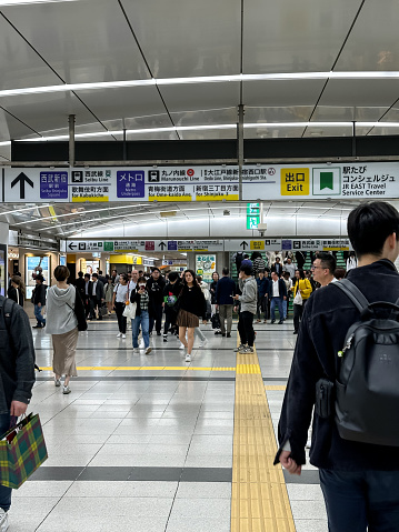 Tokyo, Japan - 02.11.2023. People travel at Shinjuku train station in Tokyo Japan. Commuters in Tokyo, Japan.