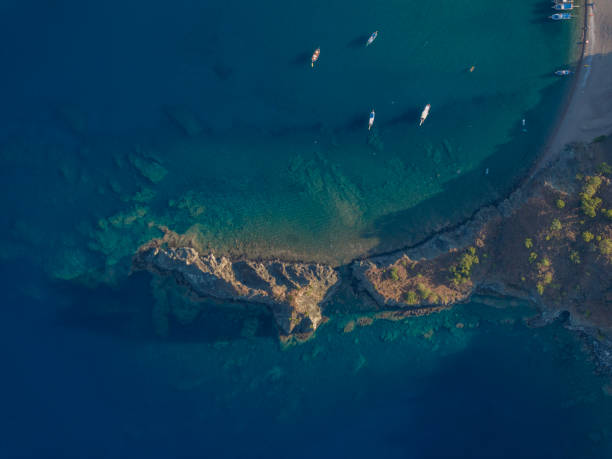 istock Tourboats waiting on the beach 1798926020