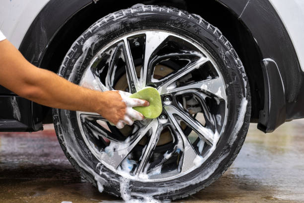 istock Car wheel is washing in soap suds 1798987453