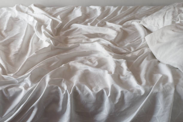 istock Top view of wrinkles on an unmade bed sheet 1798992904