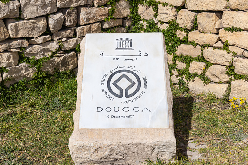 Dougga, Beja, Tunisia. March 7, 2023. Plaque at the entrance to the Roman ruins. in Dougga.