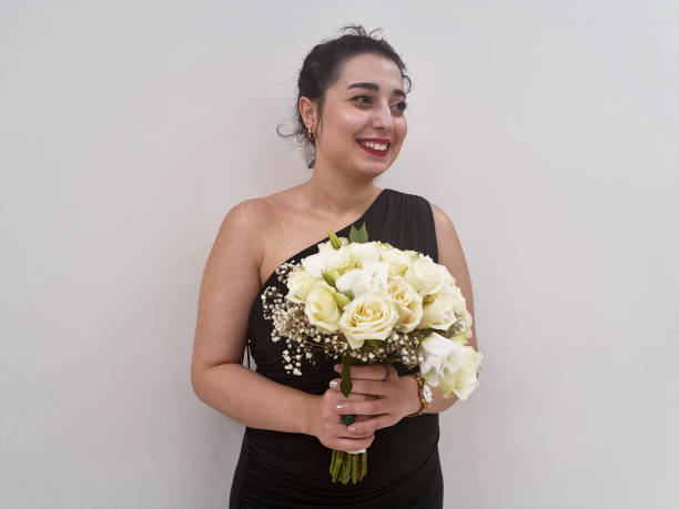 istock She is holding a flower bouquet 1799025827