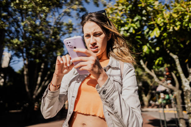 Young woman using mobile phone outdoors