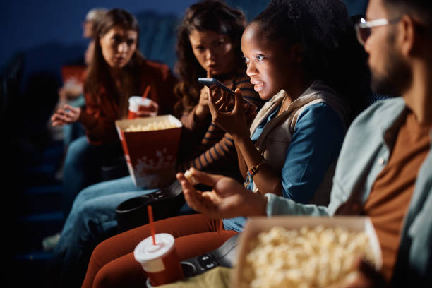 istock I can't talk right now, I'm at the cinema! 1799049644