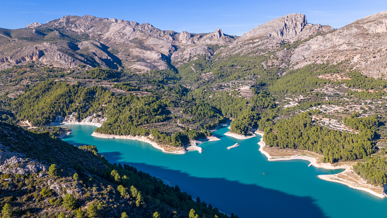 This aerial drone photo shows the mountain lake named Guadalest in the province of Alicante, Spain.