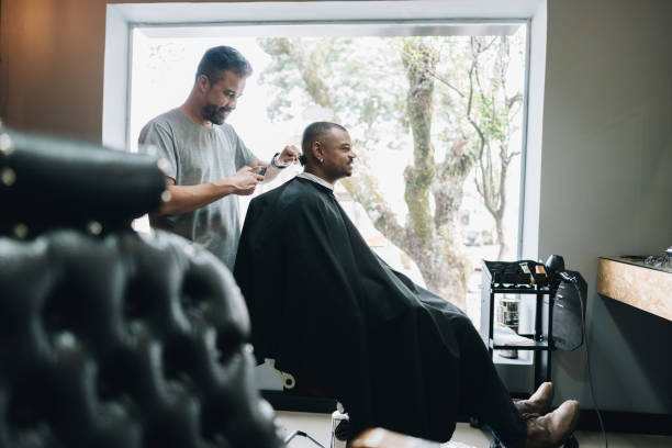 Barber cutting customer's hair in a barber shop