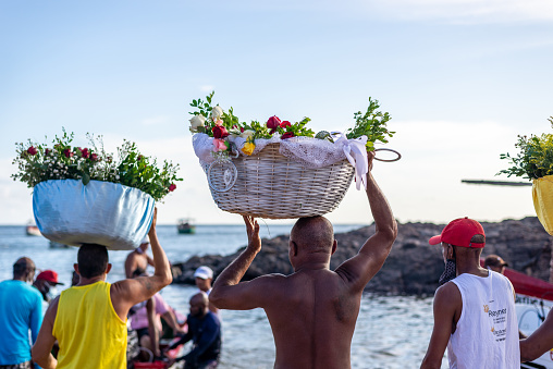 Salvador, Bahia, Brazil - January 30, 2022: Gifts for iemanja are taken to the sea by fishermen in the city of Salvador, Bahia.