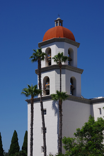 Church bell tower under blue sky in southern California