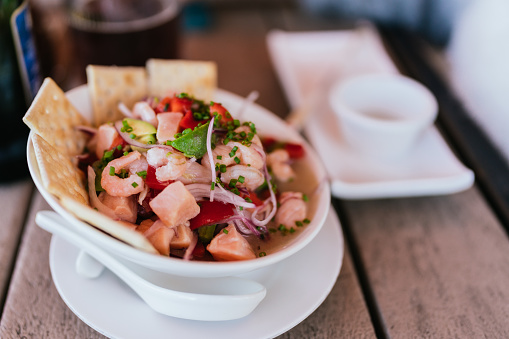 closeup of plate of ceviche on restaurant table