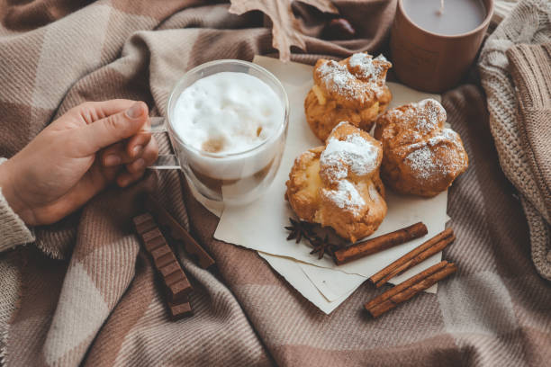istock Cup of coffee in hands, cozy autumn 1799091010