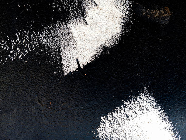 istock Black paint stains on cement wall. Abstract black paint grunge background. Paint texture with copy space. 1799140392