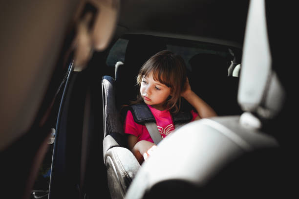 istock Little child sitting in a car seat. 1799223664