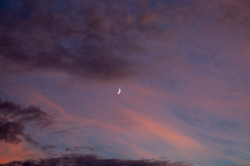 Clouds and crescent at sunset