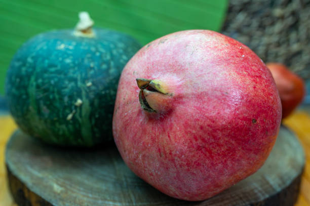 istock Autumn colors, Pomegranate and pumpkins 1799252629