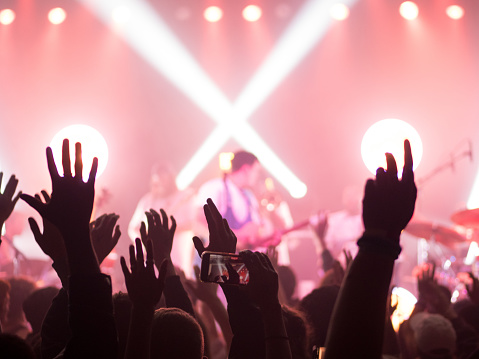 Hands up at a club concert