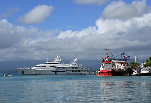 Pointe-à-Pitre, Guadeloupe: yachts, harbor tugs and pilot boats moored at the Port of Guadeloupe - Quai Lardenoy dock along the 'darse' basin.