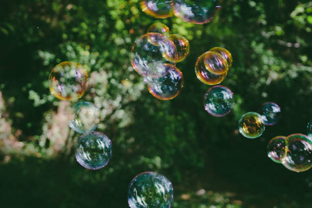 istock soap bubbles on green natural background 1799286109
