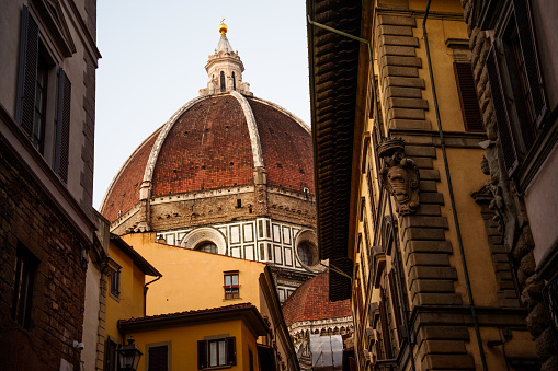 Duomo Santa Maria Del Fiore Dome in Florence Italy Early Morning with buildings in foreground