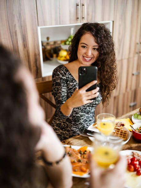 istock Young mixed race couple enjoying brunch at home 1799320970