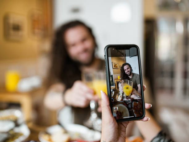 istock Young mixed race couple enjoying brunch at home 1799321476